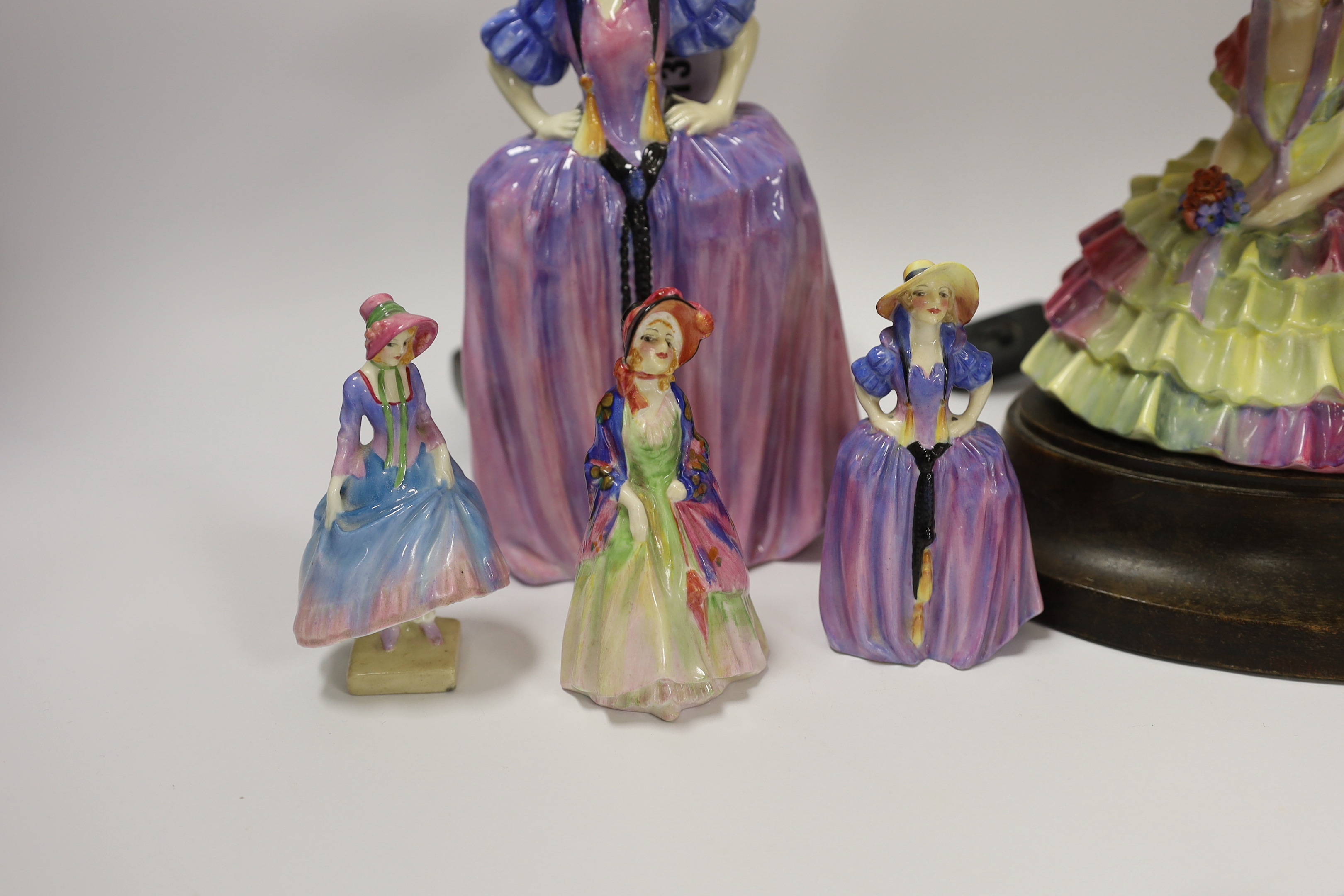 Six Royal Doulton figurines comprising two Patricia HN1431 (one miniature), miniature Pantalettes, The Paisley Shawl and Sweet Anne together with Chloe HN1470, mounted as a lamp